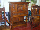 Renaissance-style cabinet and armchairs